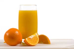 Fresh oranges and orange juice