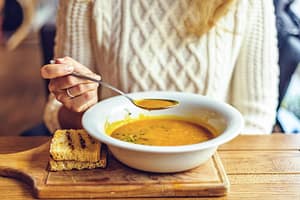 Woman Eating Soup