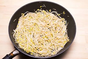 Stir-fried adzuki bean sprouts Moyashi in a pan