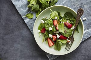 Fresh Salad with Spinach, strawberry, feta, and pumpkin seeds