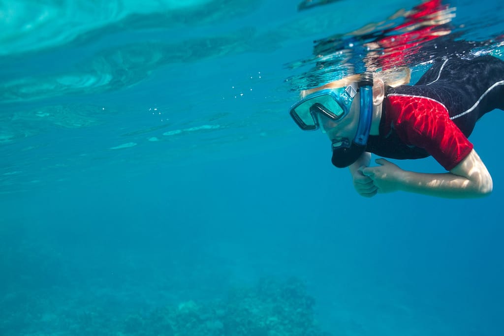 a person positioning his body to snorkel