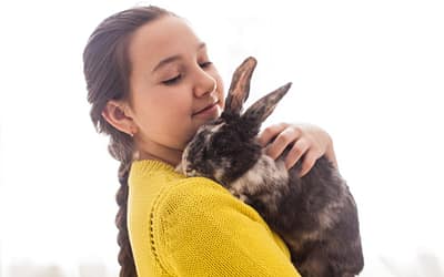 a new rabbit owner carrying her pet